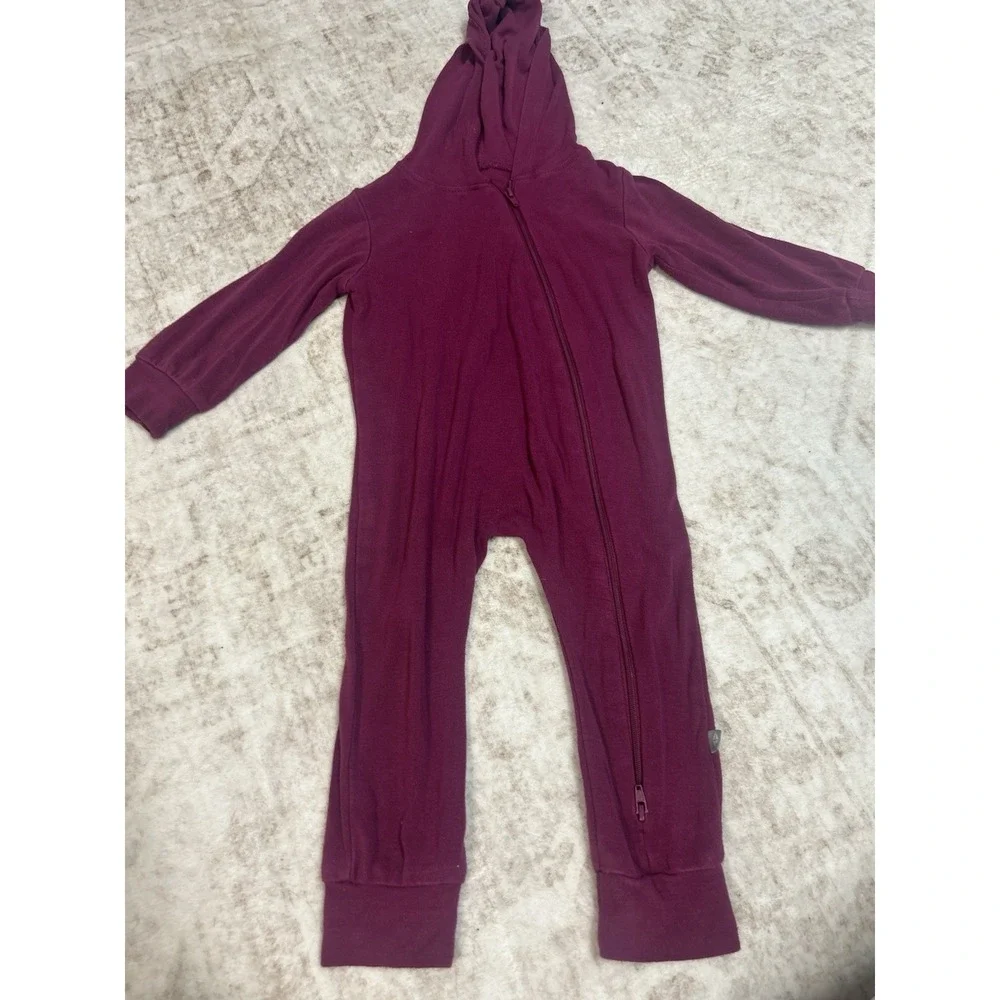 Kyte Baby Bamboo Jersey Hooded Zippered Romper in the color Dahlia